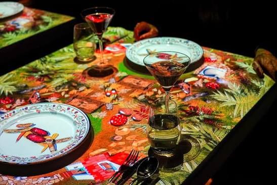 Dining table with projected illustrations
